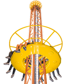 A tall indoor drop tower named La Tour with a yellow circular platform and visible dangling legs